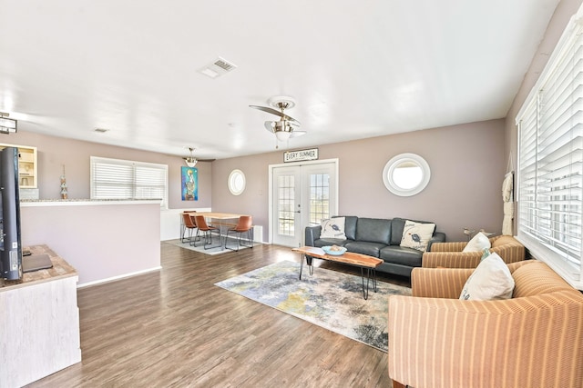 living room with hardwood / wood-style flooring and french doors