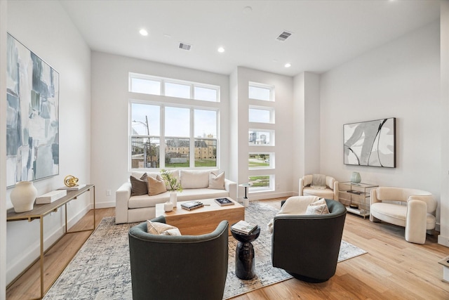 living room with light hardwood / wood-style flooring