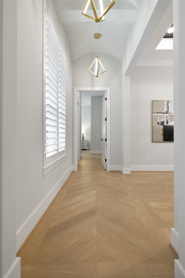 hallway featuring lofted ceiling