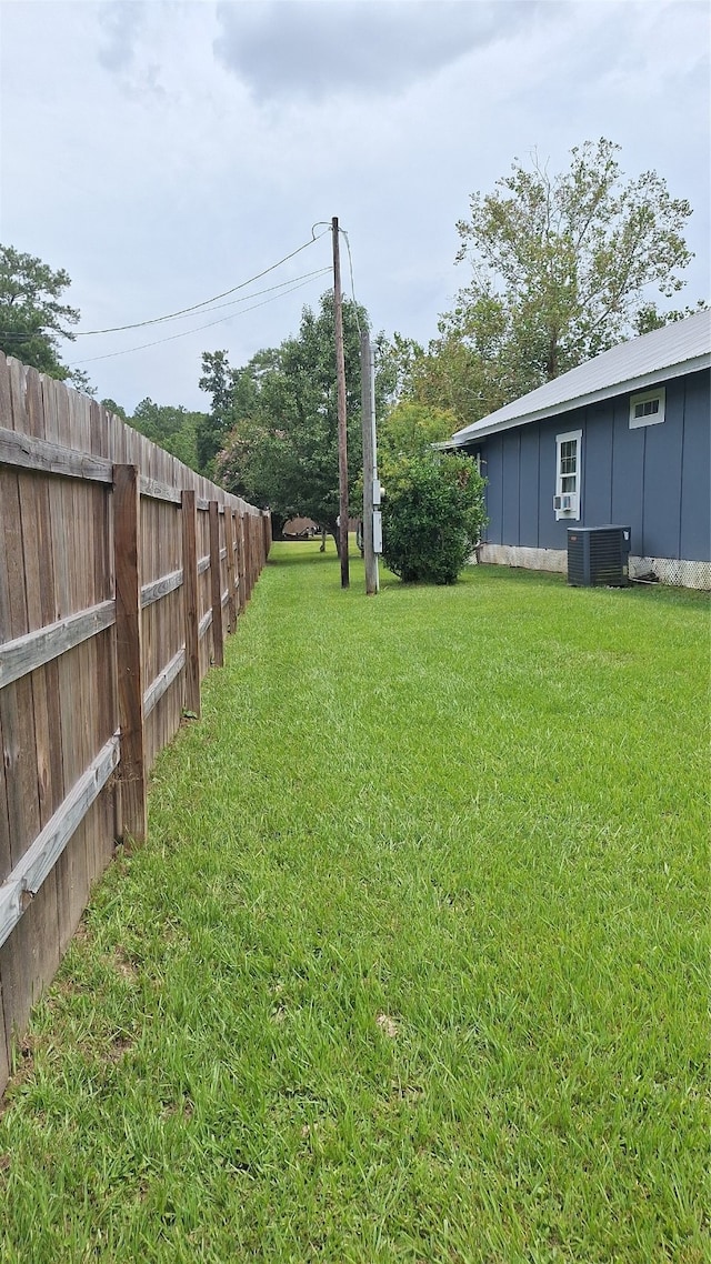 view of yard with central AC