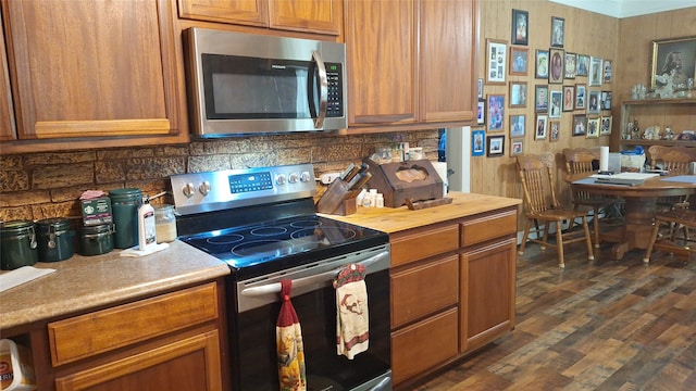 kitchen featuring dark hardwood / wood-style floors and stainless steel appliances