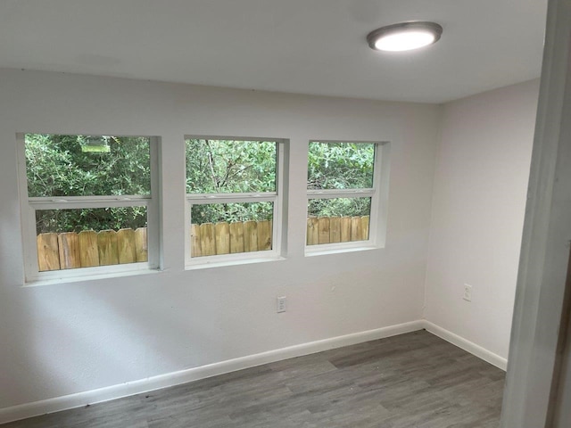 spare room featuring dark hardwood / wood-style flooring