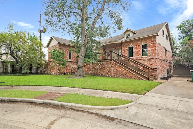 view of front of home featuring a front yard and a garage