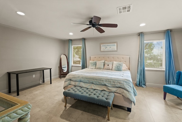 bedroom featuring ornamental molding, multiple windows, and ceiling fan