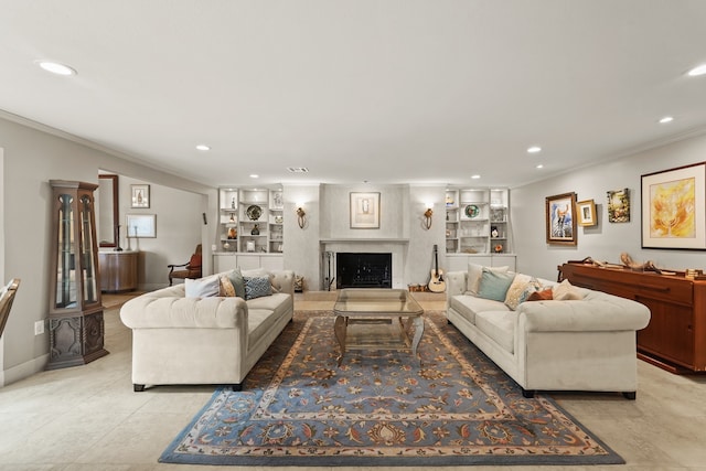 living room featuring built in features, a large fireplace, and crown molding