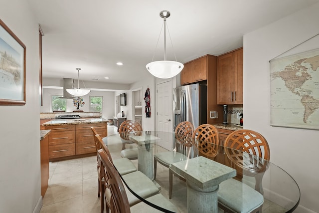 dining area with light tile patterned floors