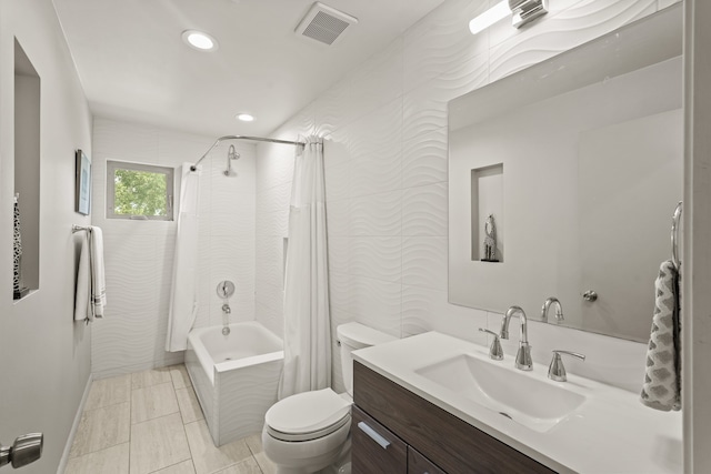 full bathroom featuring vanity, toilet, and shower / bath combo