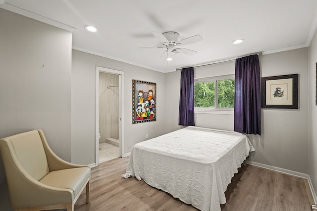 bedroom with ornamental molding, hardwood / wood-style flooring, ensuite bath, and ceiling fan