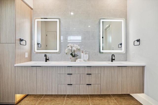 bathroom featuring vanity, tile walls, and decorative backsplash