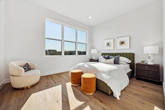 bedroom with light hardwood / wood-style flooring