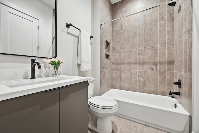 full bathroom with vanity, tiled shower / bath combo, toilet, and tile patterned flooring