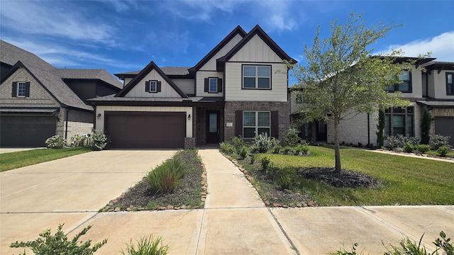 view of front facade with a garage and a front lawn