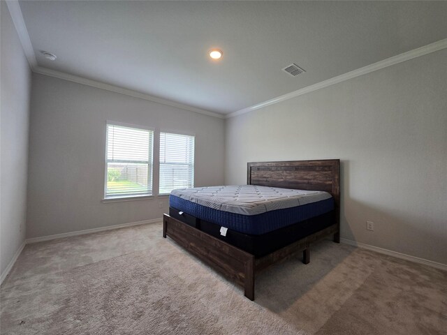 carpeted bedroom with crown molding