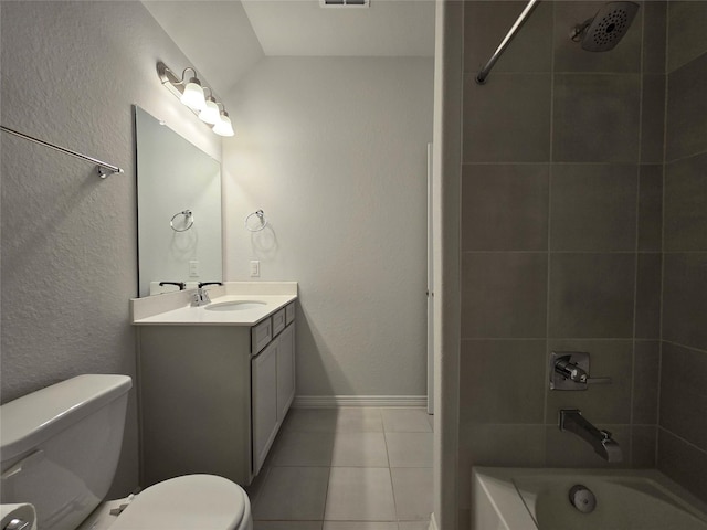 full bathroom with vanity, toilet, tiled shower / bath combo, and tile patterned flooring