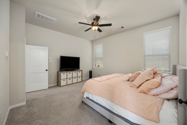 bedroom with ceiling fan and light colored carpet