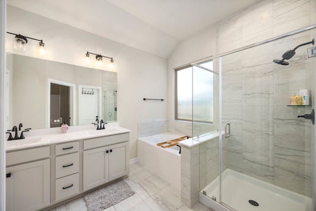 bathroom with tile patterned flooring, double vanity, separate shower and tub, and vaulted ceiling