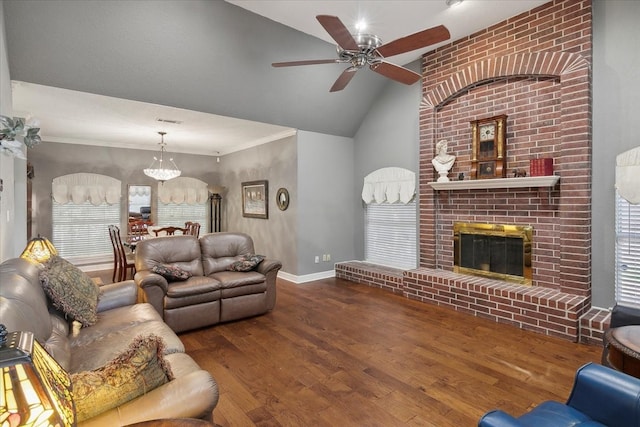 living room featuring ceiling fan, hardwood / wood-style flooring, vaulted ceiling, and ornamental molding