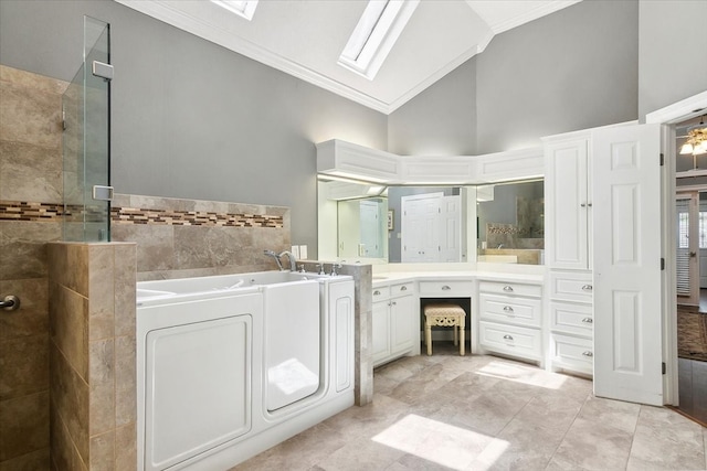 bathroom featuring a skylight, tile patterned floors, crown molding, and high vaulted ceiling