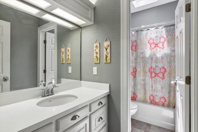 full bathroom featuring tile patterned floors, shower / bathtub combination with curtain, vanity, and toilet