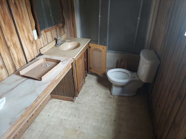 bathroom with vanity, tile patterned flooring, and toilet