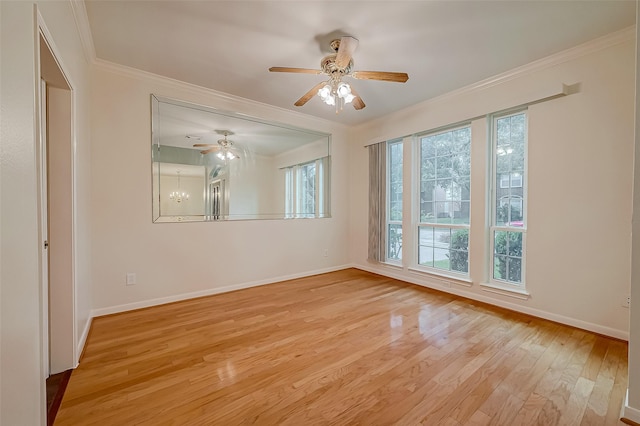 empty room featuring light hardwood / wood-style floors, crown molding, and an inviting chandelier