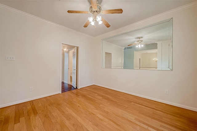 empty room featuring hardwood / wood-style floors, ceiling fan, and ornamental molding