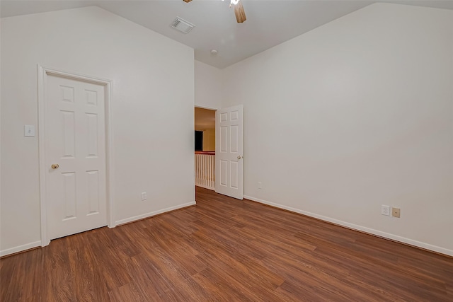 empty room with ceiling fan, wood-type flooring, and lofted ceiling