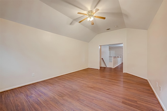 interior space featuring ceiling fan, vaulted ceiling, and hardwood / wood-style flooring