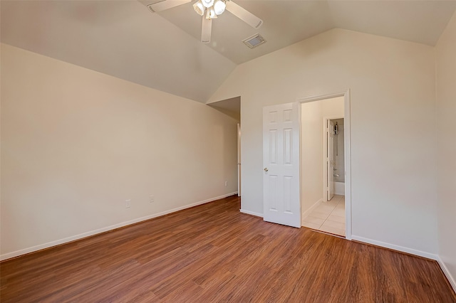 unfurnished bedroom featuring ceiling fan, light hardwood / wood-style floors, and lofted ceiling