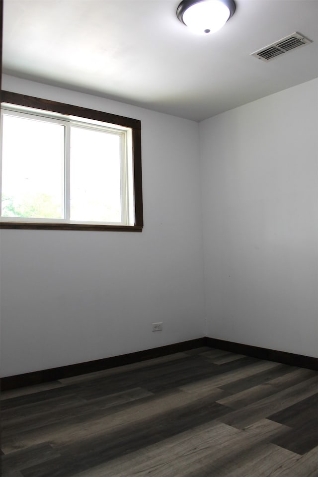 unfurnished room featuring hardwood / wood-style flooring