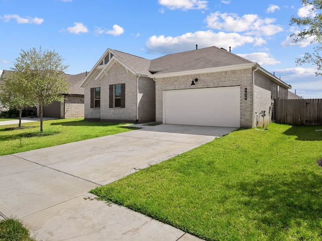 view of front of home with a front lawn and a garage