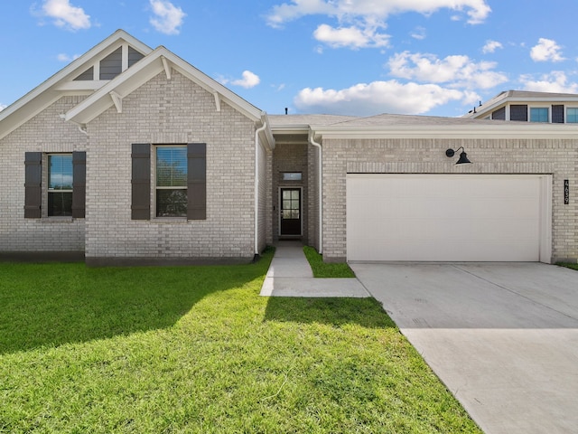 view of front facade with a front yard and a garage