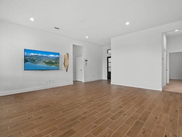 unfurnished living room with hardwood / wood-style floors