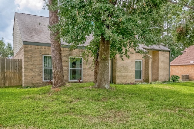 back of house with a yard