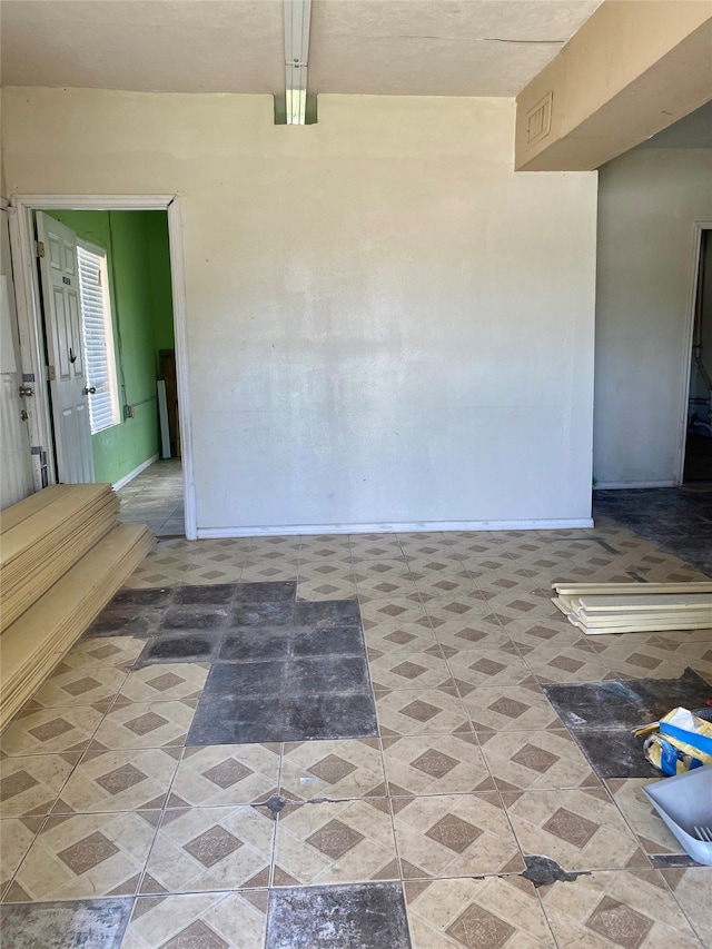 unfurnished room with light tile patterned floors