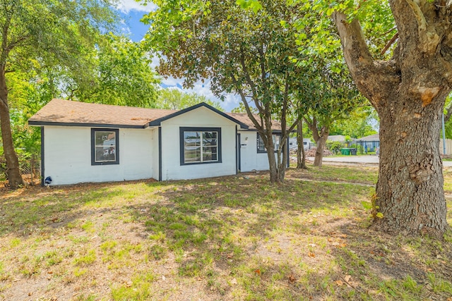 view of property exterior featuring a yard