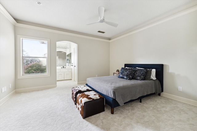 bedroom featuring ceiling fan, light carpet, and crown molding