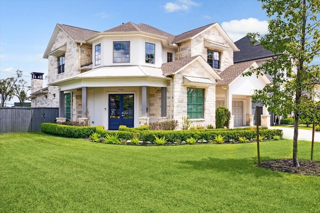 view of front of home featuring french doors and a front lawn