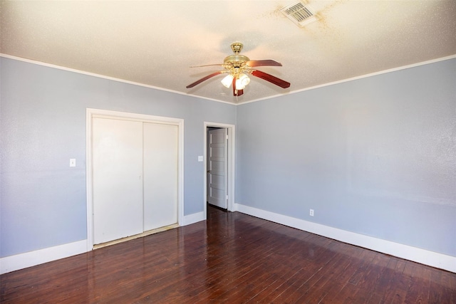 unfurnished bedroom with ceiling fan, ornamental molding, and hardwood / wood-style flooring