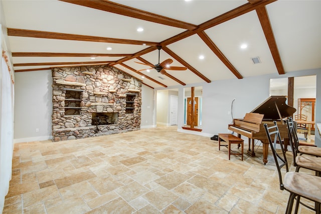 living room featuring ceiling fan, a fireplace, and vaulted ceiling with beams