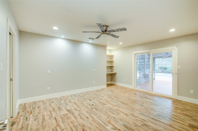 empty room featuring hardwood / wood-style floors and ceiling fan