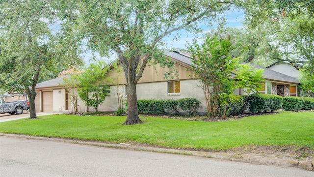 view of home's exterior featuring a yard and a garage