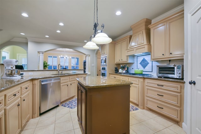 kitchen featuring appliances with stainless steel finishes, premium range hood, a center island, light tile patterned floors, and sink