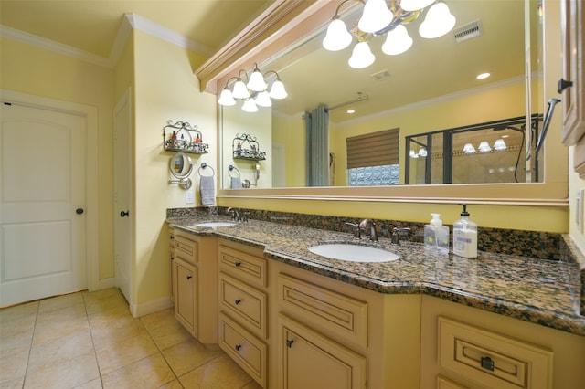 bathroom featuring tile patterned flooring, double sink vanity, an inviting chandelier, and crown molding