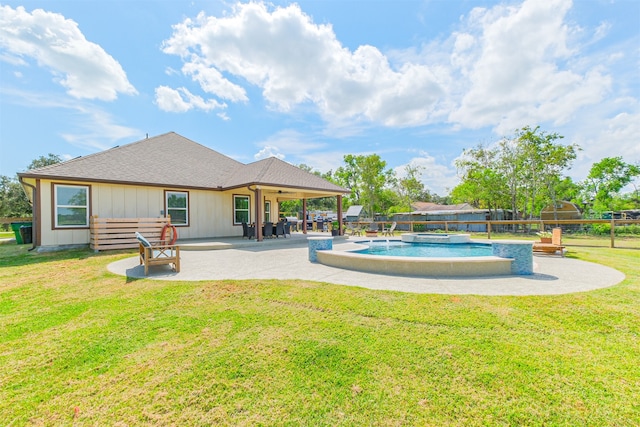 view of pool featuring a lawn and a patio area