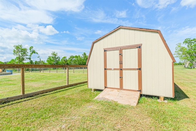 view of outdoor structure with a lawn