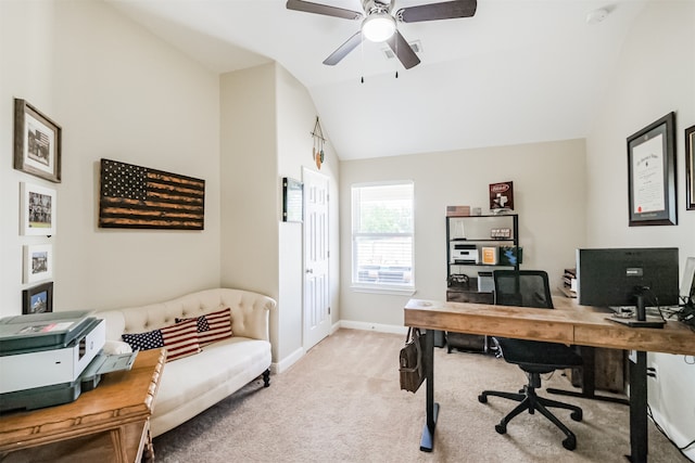 carpeted home office featuring ceiling fan and vaulted ceiling