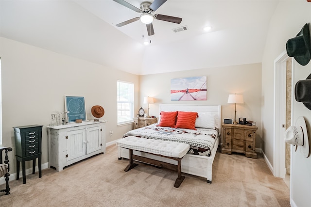 bedroom featuring ceiling fan, vaulted ceiling, and light colored carpet