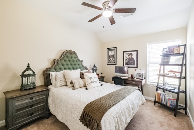 carpeted bedroom with vaulted ceiling and ceiling fan