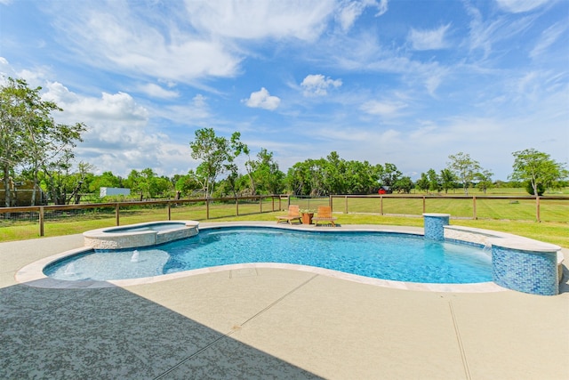 view of pool featuring an in ground hot tub, a patio area, and a yard